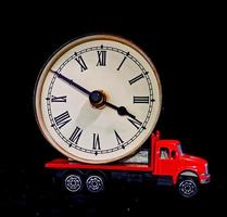 Toy truck carrying a clock photo