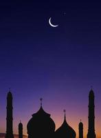 Silhouette of Mosques Dome and Crescent Moon on dark blue Twilight sky Background in vertical frame, symbol islamic religion Ramadan and free space for text arabic, Eid al-Adha, Eid al-fitr, Mubarak photo