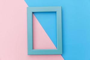 Simply design with empty blue frame isolated on pink and blue pastel colorful background. Top view, flat lay, copy space, mock up. Minimal concept. photo