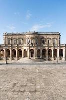 Noto,Italy-May 8, 2022-View of the Ducezio palace from from the top of the stairway of the Cathedral during a sunny day photo