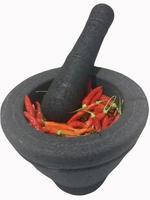 Stone Mortar and Pestle isolated on white background with clipping path.Stone mortar is an important tool in making chili curry in Thai food. photo