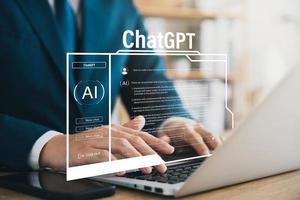 Data search concept using artificial intelligence chatbot ChatGPT, young businessman chatting with smart chatbot To find business economic information, artificial intelligence developed by OpenAI. photo