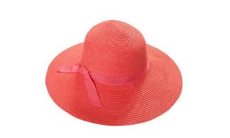 Pretty straw hat with ribbon and bow on white background. Beach hat top view isolated photo