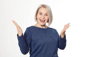 Attractive middle aged woman with folded arms on white background photo