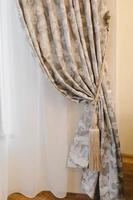 curtains in flowers with Holder. interior detail, curtain detail photo