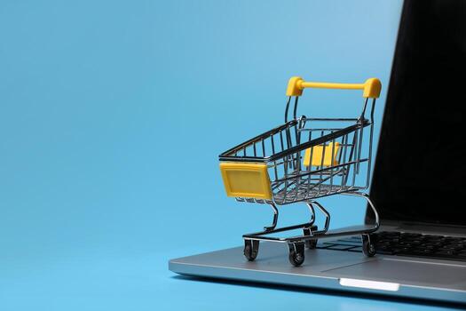 an empty shopping cart on a laptop computer. symbolic photo for shopping on the internet