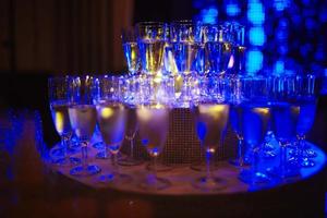 Many glass of wine on a table. Glasses with wine. Filled with half and stand on the holiday table. Furshet. selective focus photo