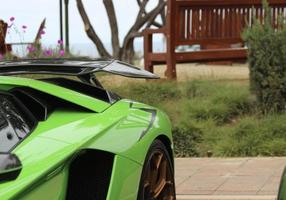 green sleek italian sports car photo
