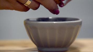 Leiria, Portugal - Woman Breaking Egg To A Small Bowl - Closeup Shot video