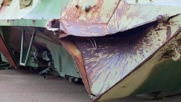 Russian combat vehicle, with holes in the armor. Destroyed military armored vehicles, disabled, blown up and destroyed. Armor metal background with bullet holes. Hole from cumulative penetration. video