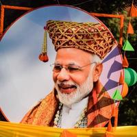 New Delhi, India - January 16 2023 - Prime Minister Narendra Modi cut out during BJP road show, the status of PM Modi while attending a big rally in the capital photo