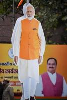 New Delhi, India - January 16 2023 - Prime Minister Narendra Modi cut out during BJP road show, the status of PM Modi while attending a big rally in the capital photo