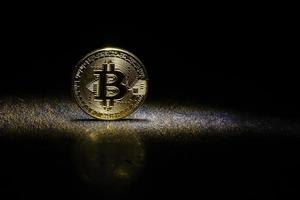 Golden bitcoins with the spotlight photo