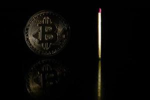 Golden bitcoin on black background with copy space cryptocurrency mining concept photo