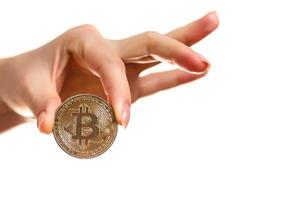 Isolated of hand putting a bitcoin concept human hand with bitcoin hand with bitcoin photo