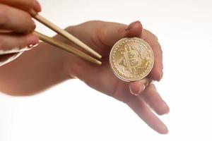 Isolated of hand putting a bitcoin concept human hand with bitcoin hand with bitcoin photo