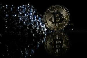 Golden bitcoin on black background with copy space cryptocurrency mining concept  silver photo