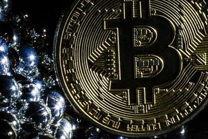 Golden bitcoin on black background with copy space cryptocurrency mining concept  silver photo