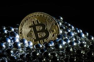 Golden bitcoin on black background with copy space cryptocurrency mining concept  silver photo