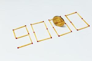 Golden bitcoin on isolate white background concept mining 9000 photo