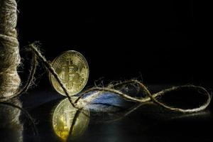 Golden bitcoin on black background with copy space cryptocurrency mining concept photo