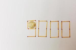 Golden bitcoin on isolate white background concept mining 9000 photo