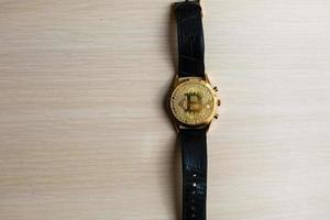 Watches with bitcoin close up photo