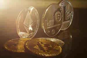 silver coins of a digital crypto currencies litecoin and bitcoin Ethereum photo