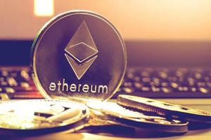 ethereum on gold background to illustrate blockchain and cyber currency photo