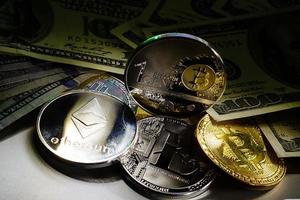 bitcoin on one hundred dollar bills photo