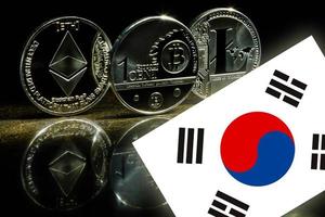 Physical version of bitcoin litecoin gold us dollar and south korea flag conceptual image photo