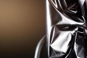 silvery leather on a black background photo