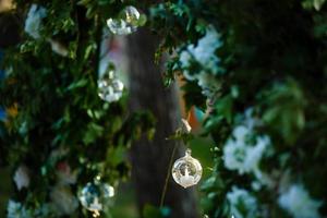 Original wedding floral decoration in the form of mini-vases and bouquets of flowers hanging from the ceiling photo