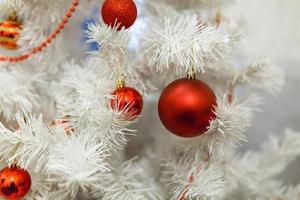 white Christmas tree and red balls photo