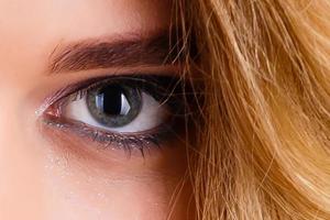 Beautiful blue woman single eye close up photo