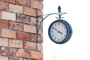 old hours, 4 hours Clock on wood table in the green garden time at o clock photo