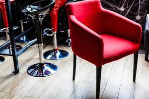 Luxurious interior of the restaurant red armchair photo