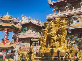 Ang Silla,Chonburi,Thailand-January 14,2023, Naja statue golden is a beautiful Thai and Chinese architecture of Nachas sa thai chute shrine, naja shrine, najasaataichue, nezha shrine chinese temple. photo