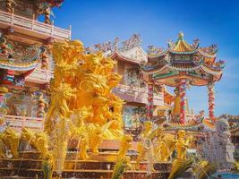 Ang Silla,Chonburi,Thailand-January 14,2023, Naja statue golden is a beautiful Thai and Chinese architecture of Nachas sa thai chute shrine, naja shrine, najasaataichue, nezha shrine chinese temple. photo