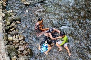 Guci, December 2022. View of people bathing in hot springs at the Guci hot spring tourist spot. photo