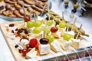 canape on the plate, Catering cheese with grapes photo