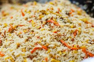 rice pilaf with meat carrot and onion background photo