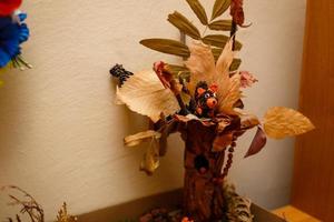 Autumn maple leaves bunch in vase photo