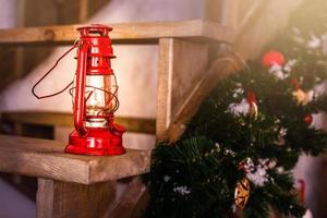 Christmas decoration card with vintage christmas toys tree branches kerosene oil lamp photo