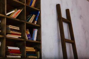 Old bookcase with the leather bound book covers in the library photo