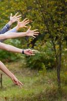 lot of children s hands reach  forming a circle photo