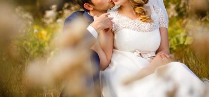 Happy bride and groom at a park on their wedding day photo