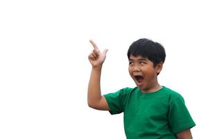 The boy smiled and pointed his hand to his side. on a white background photo