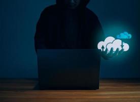 Hackers work on laptops in the dark. Concepts of information security systems in the Internet network and information espionage. Cloud computing. photo