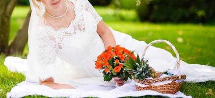 Bridal bouquet beautiful of pink wedding flowers in hands of the bride close up photo